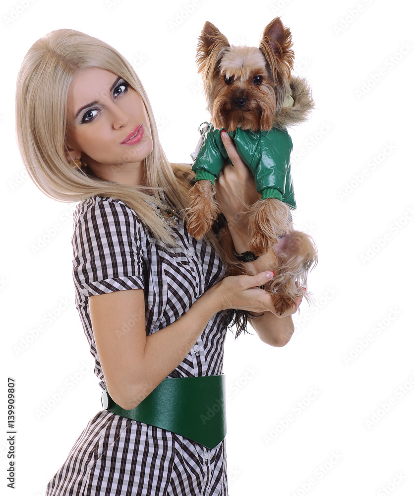The young beautiful fashionable blonde girl with a cute little dog Yorkshire terrier The young beautiful fashionable blonde girl with a cute little dog Yorkshire terrier
