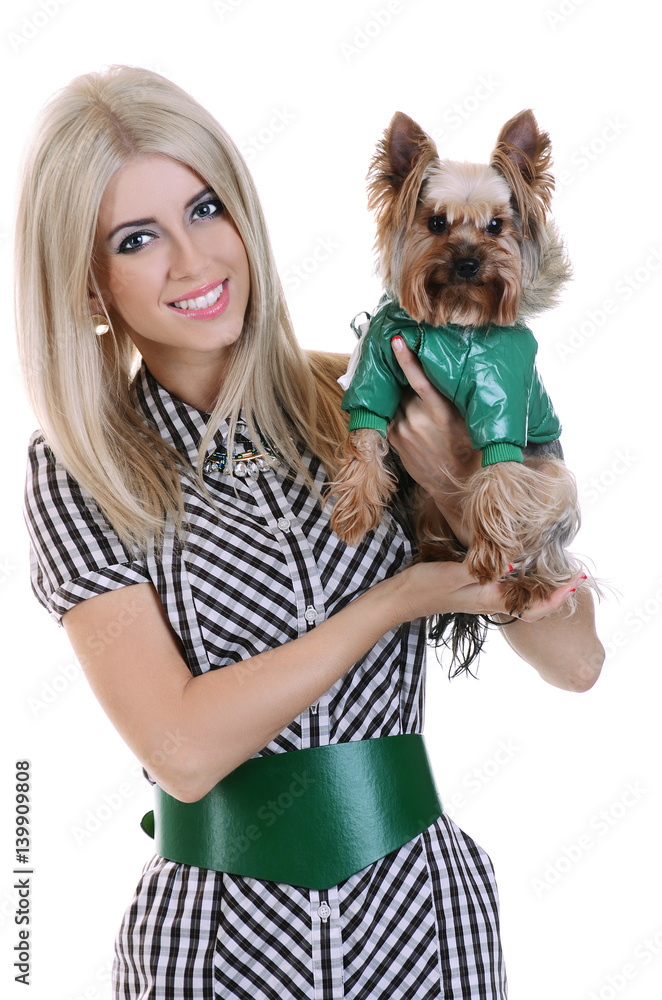 The young beautiful fashionable blonde girl with a cute little dog Yorkshire terrier The young beautiful fashionable blonde girl with a cute little dog Yorkshire terrier
