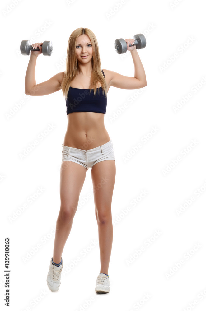 Sexy athletic girl  working out with dumbbells
