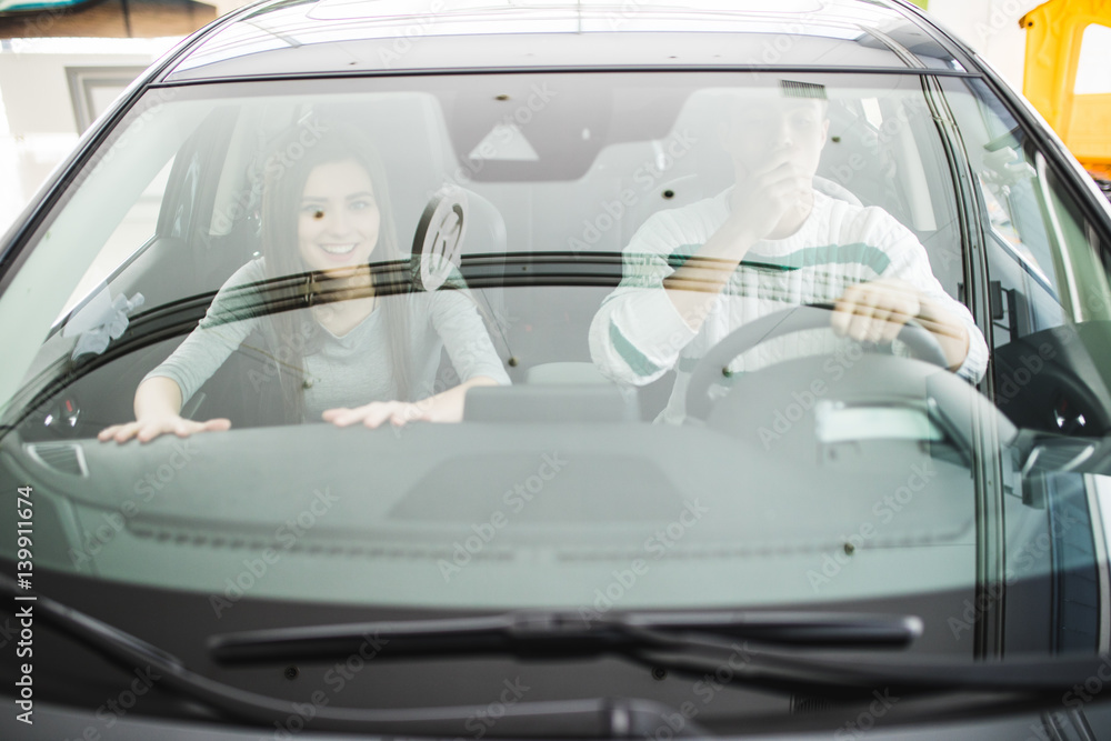 Couple in a car about to have a crash. Face emotions of scare Couple in a car about to have a crash. Face emotions of scare