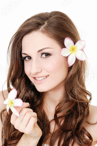 smile young woman holding white frangipani