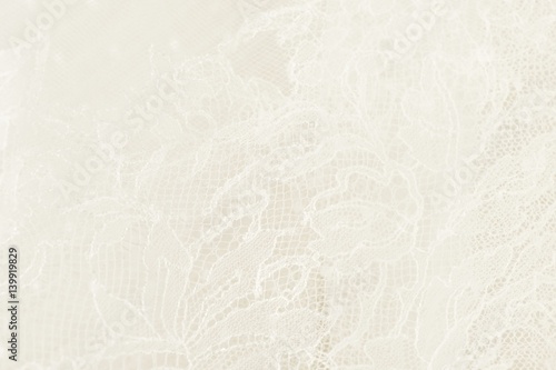 Closeup of white wedding lace with floral pattern