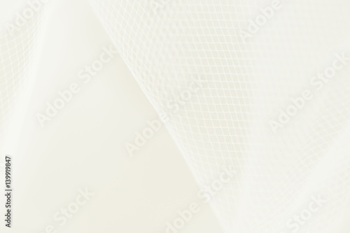 Abstract background of white wedding textile positioned diagonally. Copy space