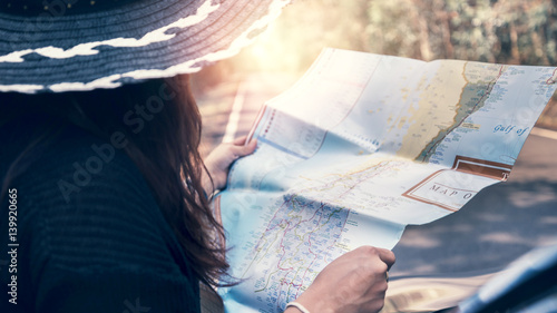 Woman driving a map of gold trails, nature, forest, mountains