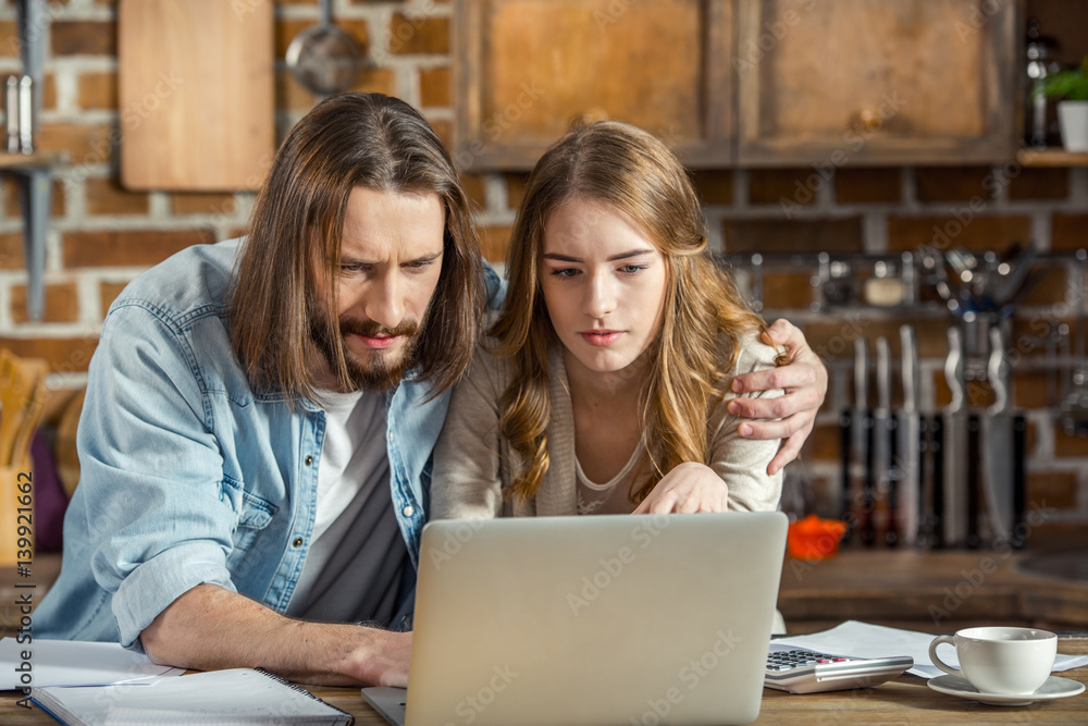 Couple using laptop Couple using laptop