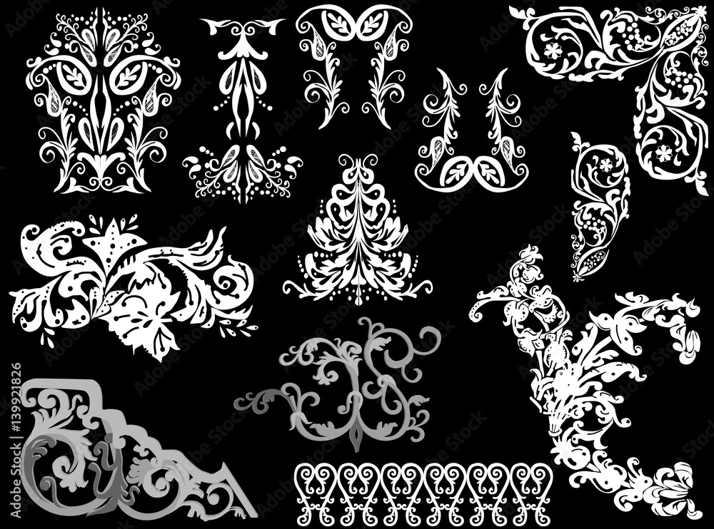 set of white and grey ornametal fragments on black set of white and grey ornametal fragments on black