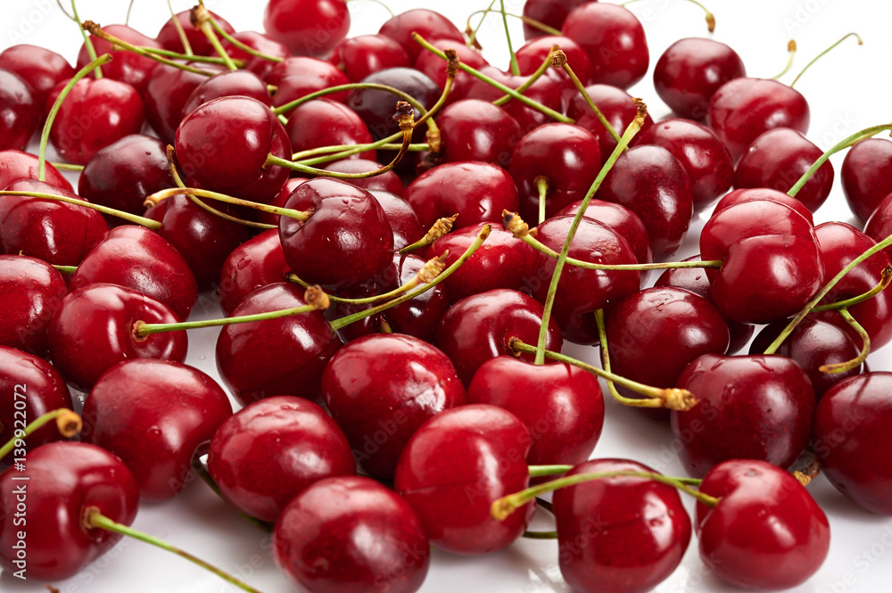 Fresh ripe cherries isolated on white background Fresh ripe cherries isolated on white background