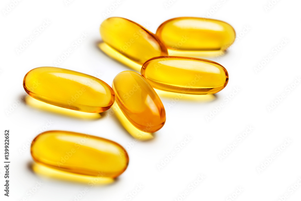Capsules Omega 3 isolated on white background. Close up, top view, high resolution product. Health care concept. Capsules Omega 3 isolated on white background. Close up, top view, high resolution product. Health care concept.