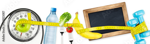 measuring tape  water bottle green apple banana dumbbell and empty slate  blackboard on white bathroom scale fitness concept panorama background / fitness waage maßband apfel tafel konzept hintergrund photo