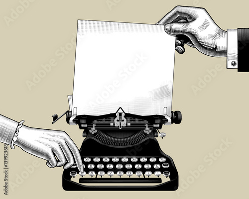 Hands of man and woman with old typewriter
