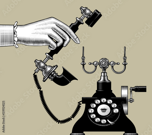 Woman's hand of man with retro black phone