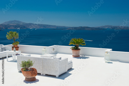 Architecture of island of Santorini, the most romantic island in the world, Greece. Hotels in Santorini. Walking the streets of Fira summer day, Travel to Greece. Beautiful white exterior Santorini 