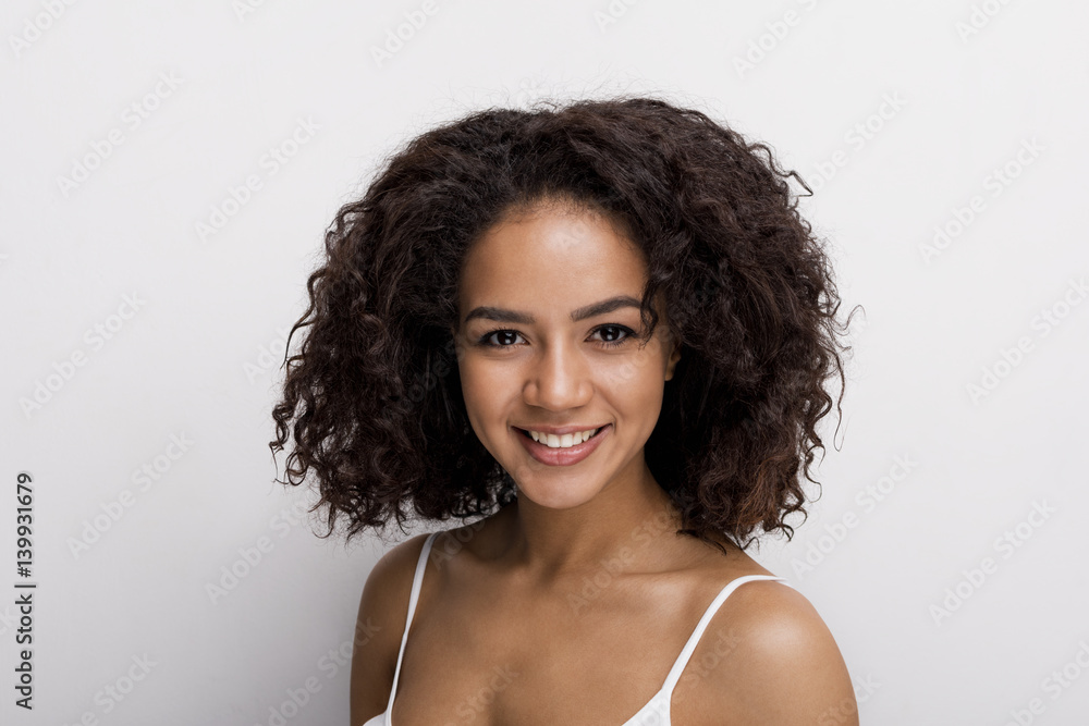 Studio portrait of a beautiful brunette woman, looking at camera Studio portrait of a beautiful brunette woman, looking at camera