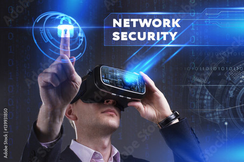 Business, Technology, Internet and network concept. Young businessman working in virtual reality glasses sees the inscription: Network security