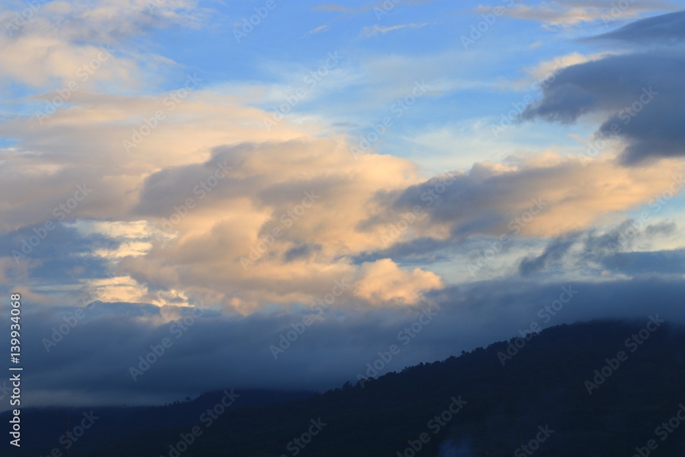 sky in sunset and cloud  colorful twilight time  with mountain silhouette, art beautiful in nature