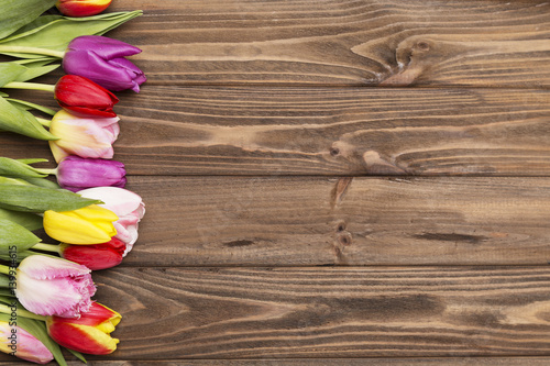 Fototapeta Naklejka Na Ścianę i Meble -  colorful tulips on wooden background.