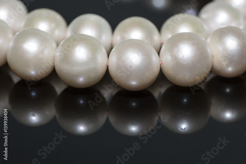 Pearl necklace on a dark background