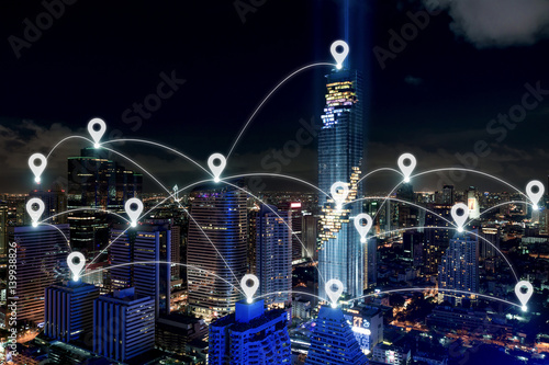 Map pin at smart city and wireless communication network, business district with office building, abstract image visual, internet of things concept photo