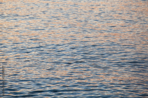 Ocean waves and the water surface at sunset
