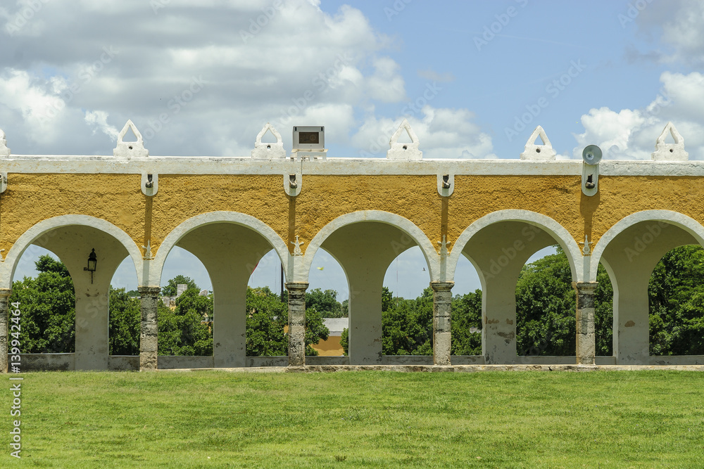 arches and columns in the courtyard of the convent of San Antonio of Padua in Izamal, Yucatan, Mexico.