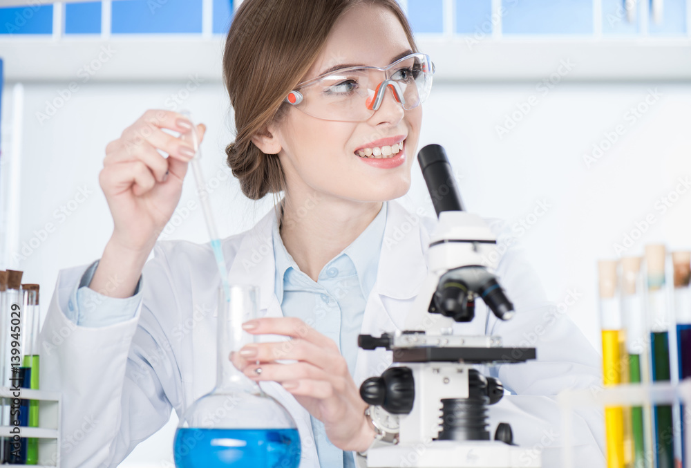 Scientist making experiment Scientist making experiment