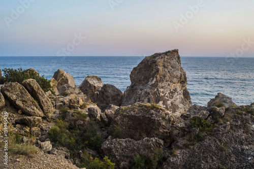 Sea and rocks at sunset © maximys15