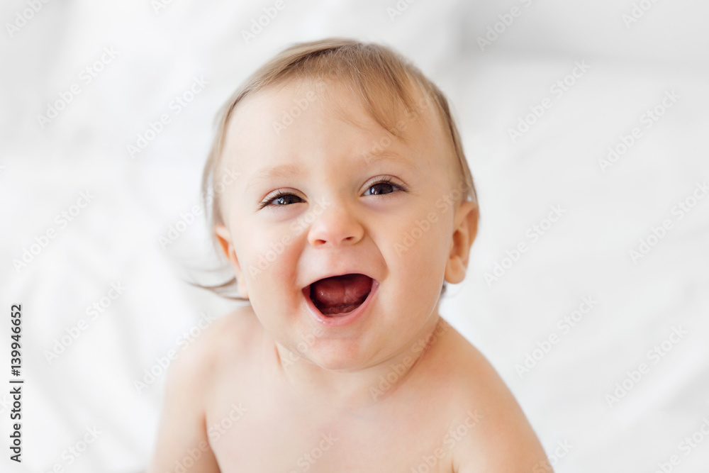 Portrait of a laughing baby with a cute expression on his face Portrait of a laughing baby with a cute expression on his face