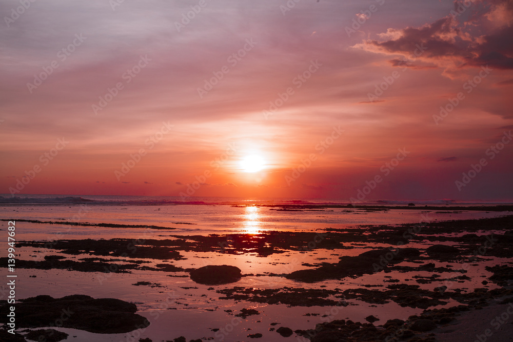 Tropical beach at beautiful sunset. Nature background Tropical beach at beautiful sunset. Nature background