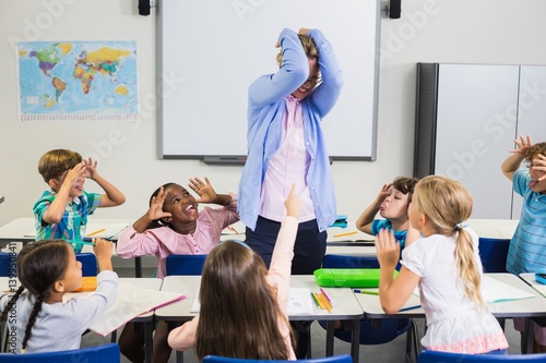 Beautiful teacher upset in during lesson photo
