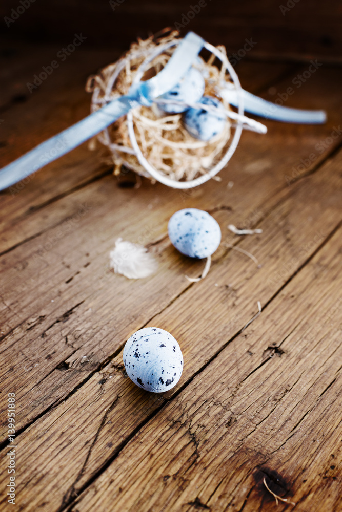 Easter basket with colored easter eggs on old rustic wooden table.free text space. Selective focus. Easter basket with colored easter eggs on old rustic wooden table.free text space. Selective focus.
