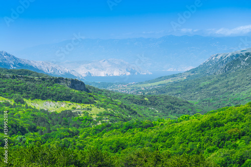 Wonderful romantic summer afternoon landscape panorama. Green, emerald valley of in the canyon plateau. Deciduous forest. Baska on the island of Krk. Croatia. Europe.