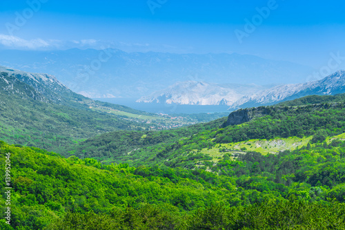 Wonderful romantic summer afternoon landscape panorama. Green, emerald valley of in the canyon plateau. Deciduous forest. Baska on the island of Krk. Croatia. Europe.