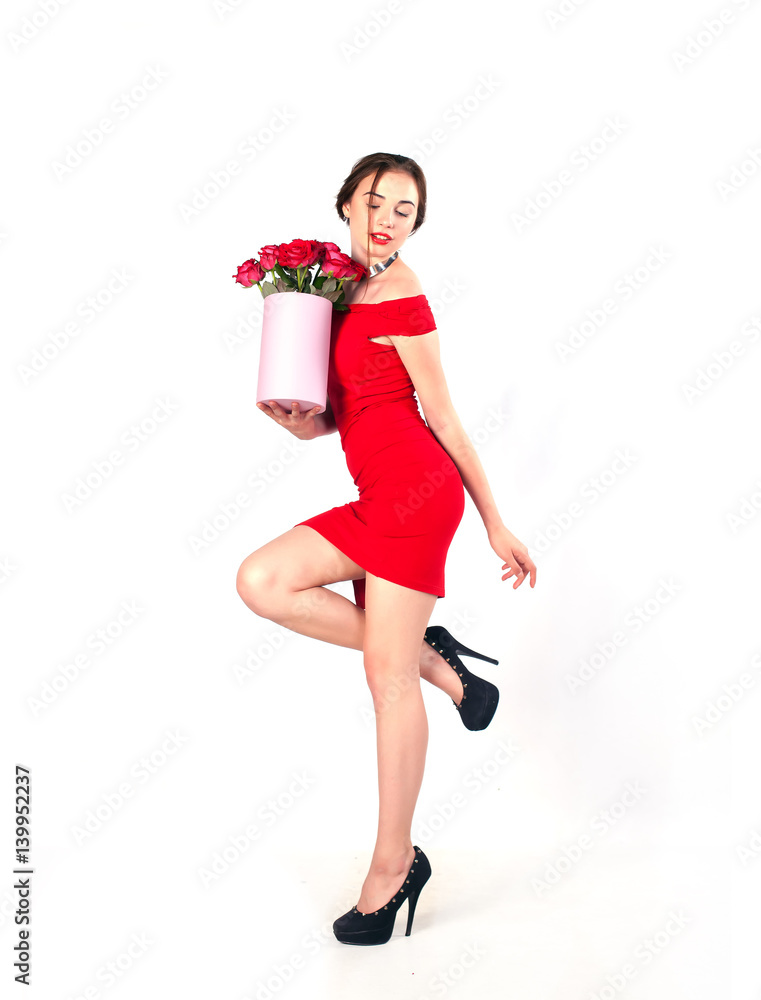 Portrait of young beautiful woman with box of flowers posing in studio in full growth. bouquet of flowers in gift box. White background isolated. Portrait of young beautiful woman with box of flowers posing in studio in full growth. bouquet of flowers in gift box. White background isolated.