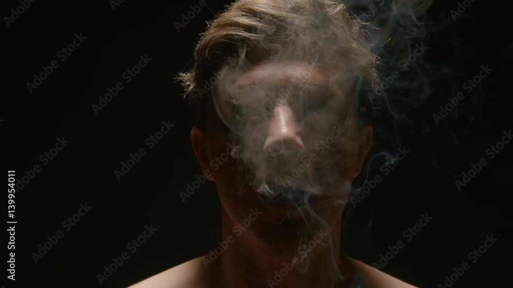 SLOW MOTION: Smoker in a smog SLOW MOTION: Smoker in a smog