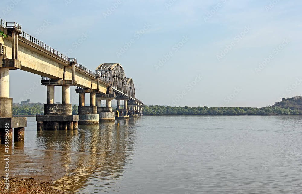 Indian railway bridge across the river Zuari in Goa, India