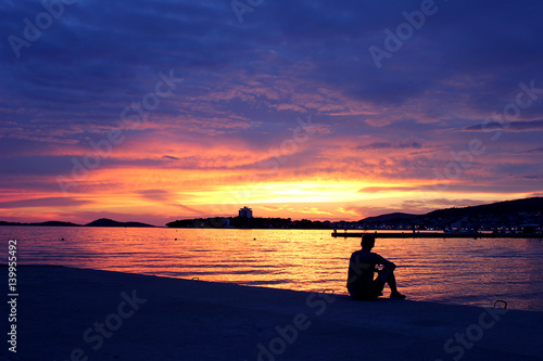 Boy in sunrise photo