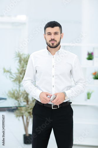 Handsome smiling confident businessman portrait © tatsianamaphoto