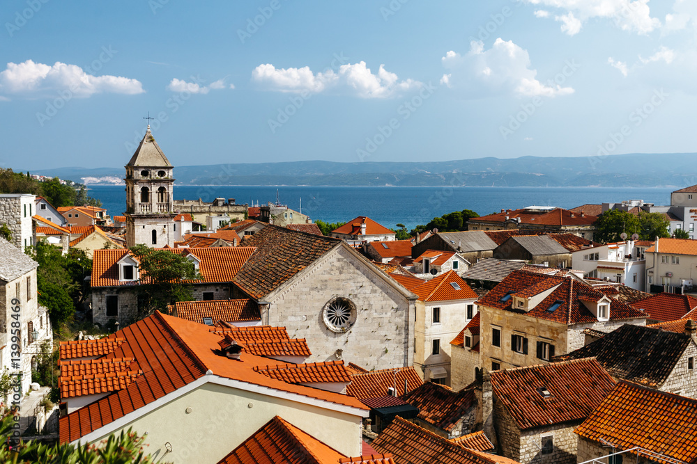 Top view of the historical part of the town of Omis and Holy Cross Church in Croatia.