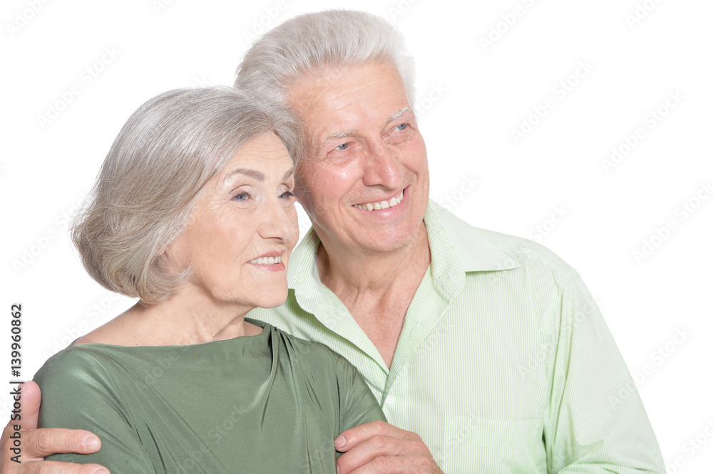 Happy old couple embracing on a white background Happy old couple embracing on a white background