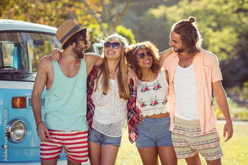 Group of friends standing together in park