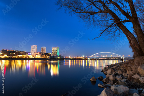 Photography Apollo bridge and bussines center in bratislava over Danube river at evening