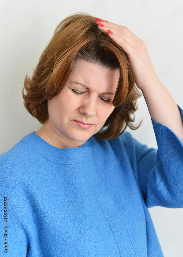 Portrait of woman experiencing a migraine Portrait of woman experiencing a migraine