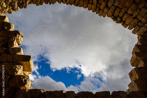 Wallpaper Mural Blue sky with clouds background framed by ancient arc of bricks and blocks, copy space for any text. Concept: direction, discovery, vision Torontodigital.ca