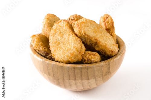 Fried chicken nuggets in bowl isolated on white background
