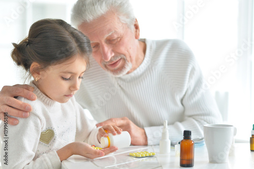 Granddaughter takes care of a sick grandfather
