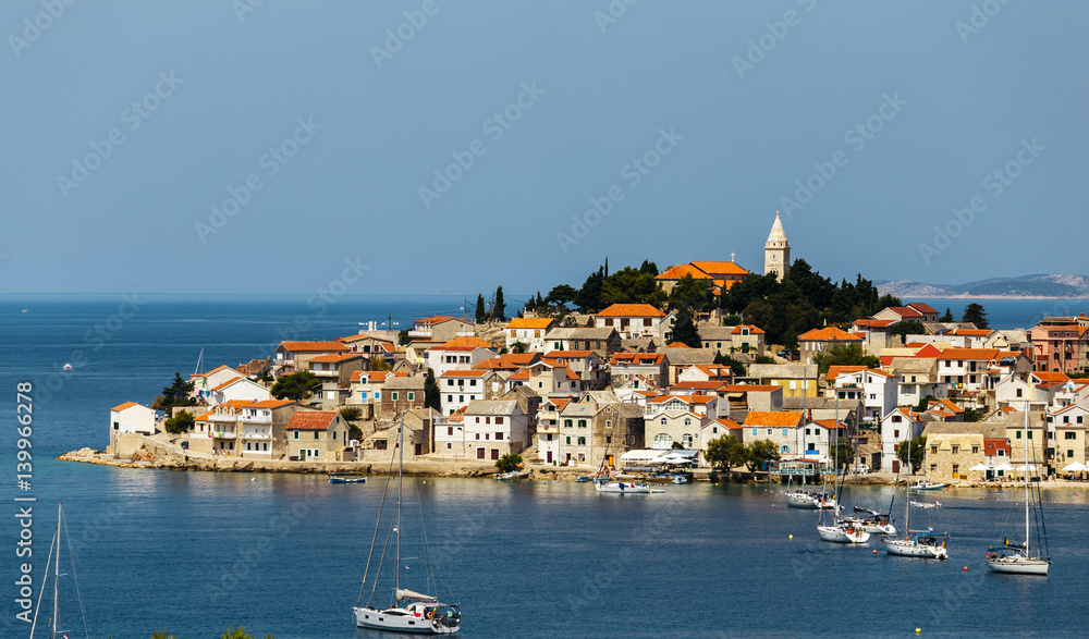 Typical city in Croatia with the tower of the church in the middle of the city.