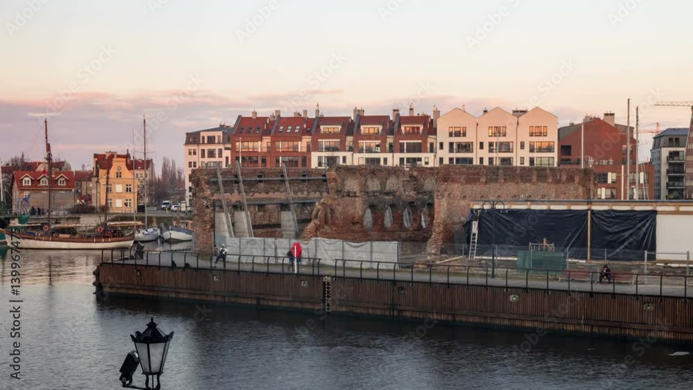 Old and modern city buildings by the river day to night timelapse. Old and modern city buildings by the river day to night timelapse.