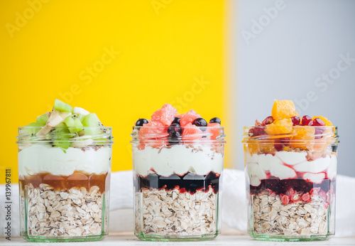 Oatmeal with fruit and cereals in a glass jar