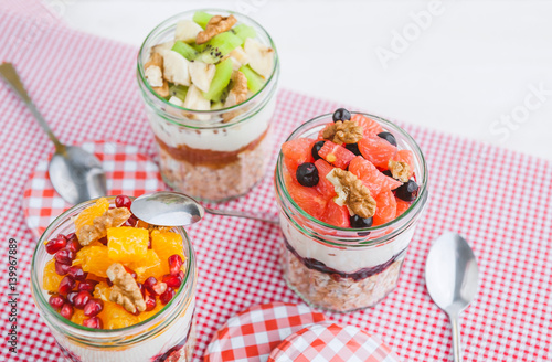 Oatmeal with fruit and cereals in a glass jar