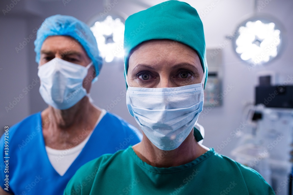 Surgeons wearing surgical mask in operation theater Surgeons wearing surgical mask in operation theater